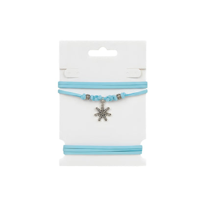 Choker azzurro con fiocco di neve silver e distanziatori metallici