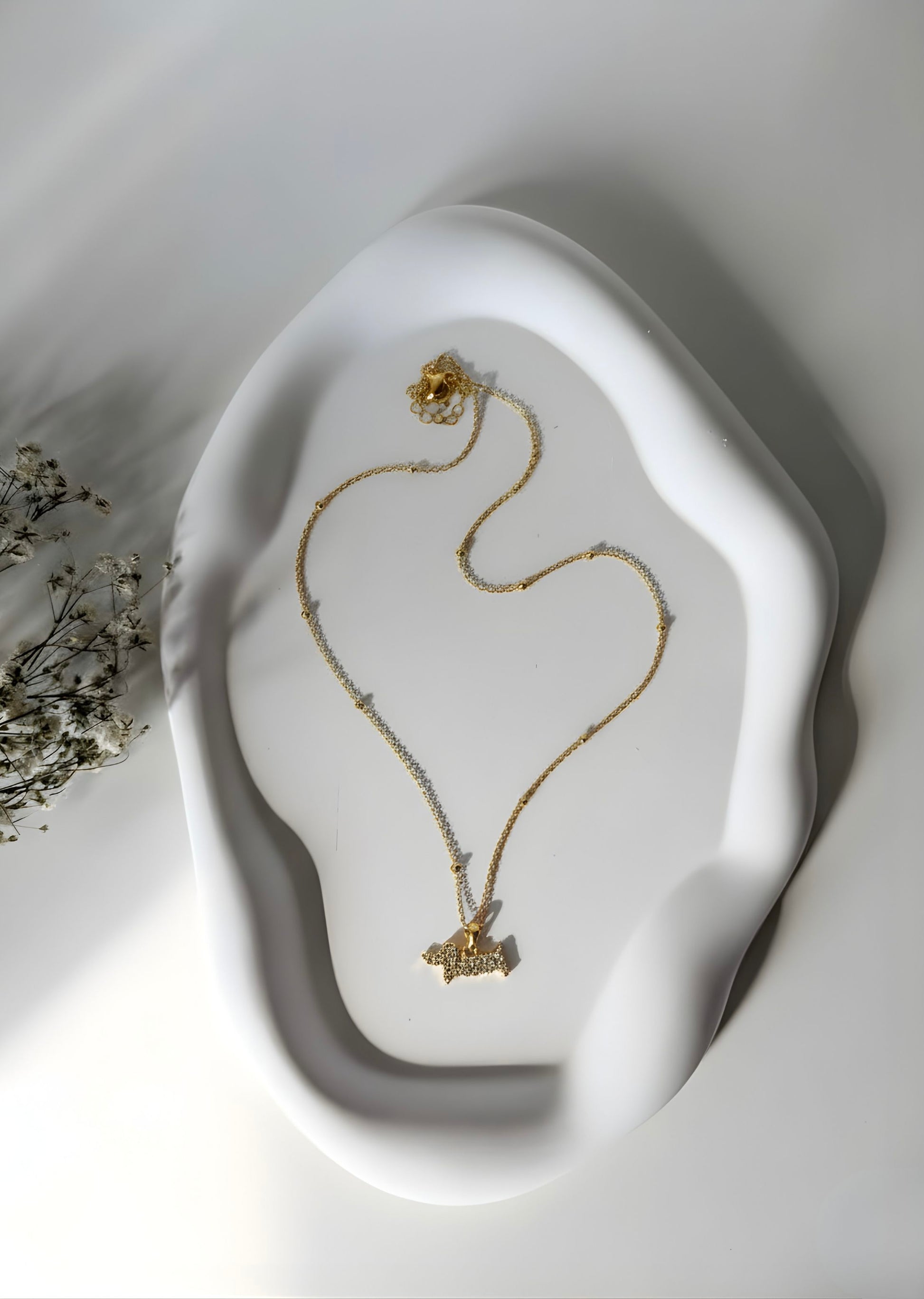 Collana in acciaio inox dorato con bassotto glitter